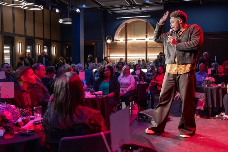Avery Wilson performing on stage at the 110th Anniversary Celebration and Opening of the new Cabaret community space